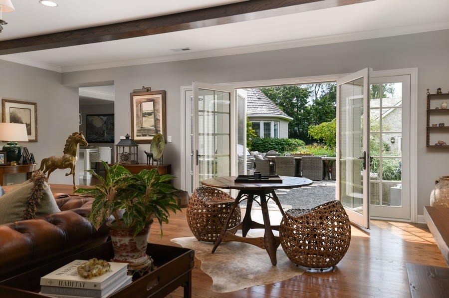 422 Sunset Ridge Road Northfield, IL 60093 - Photo 13 of 52 a living room with furniture floor to ceiling window and wooden floor