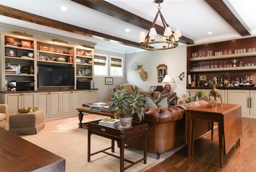 422 Sunset Ridge Road Northfield, IL 60093 - Photo 16 of 52 a living room with fireplace furniture and a flat screen tv