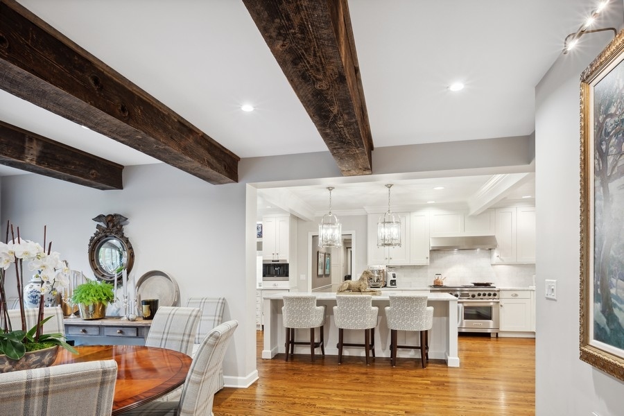 422 Sunset Ridge Road Northfield, IL 60093 - Photo 20 of 52 a living room with lots of white furniture and chandelier