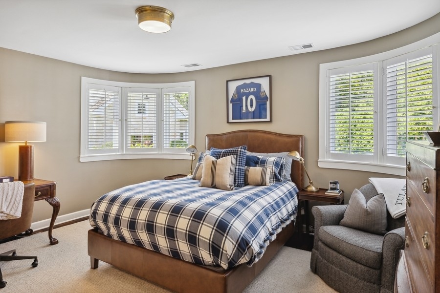 422 Sunset Ridge Road Northfield, IL 60093 - Photo 28 of 52 a bedroom with a bed couch and next to a window