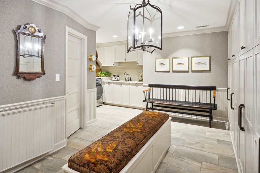 422 Sunset Ridge Road Northfield, IL 60093 - Photo 30 of 52 a kitchen with stainless steel appliances kitchen island granite countertop a refrigerator and cabinets