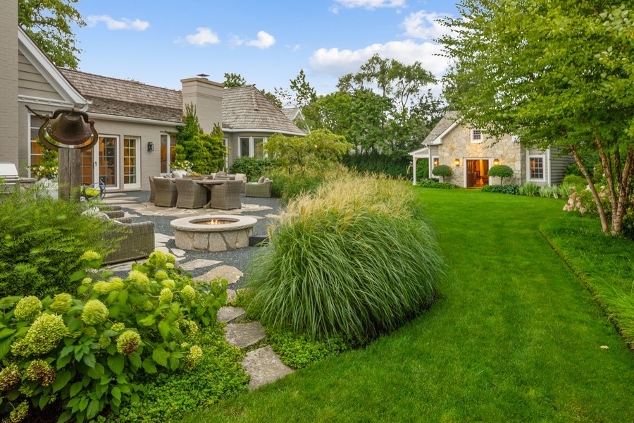 422 Sunset Ridge Road Northfield, IL 60093 - Photo 33 of 52 a front view of a house with a yard and lake view