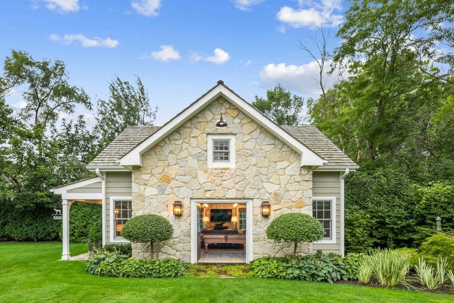 422 Sunset Ridge Road Northfield, IL 60093 - Photo 34 of 52 a front view of a house with a yard and garage
