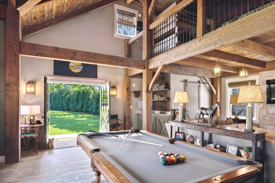 422 Sunset Ridge Road Northfield, IL 60093 - Photo 35 of 52 a living room with furniture and a large window