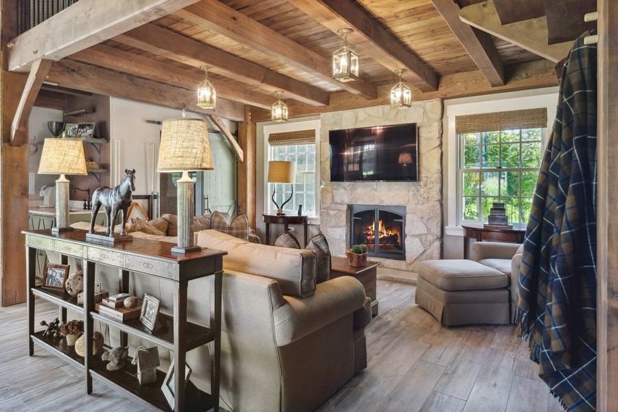 422 Sunset Ridge Road Northfield, IL 60093 - Photo 37 of 52 a living room with furniture a flat screen tv and a fireplace