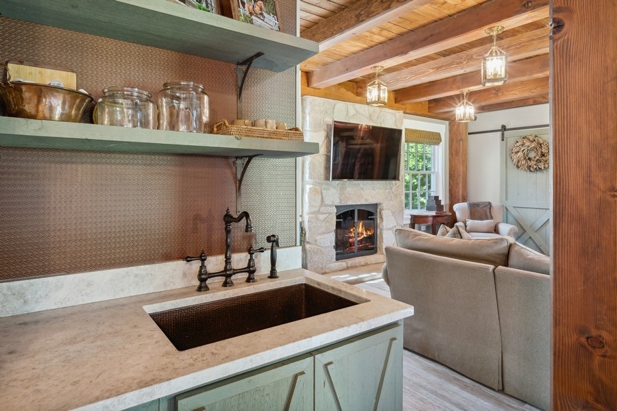 422 Sunset Ridge Road Northfield, IL 60093 - Photo 39 of 52 a living room with furniture and a fireplace