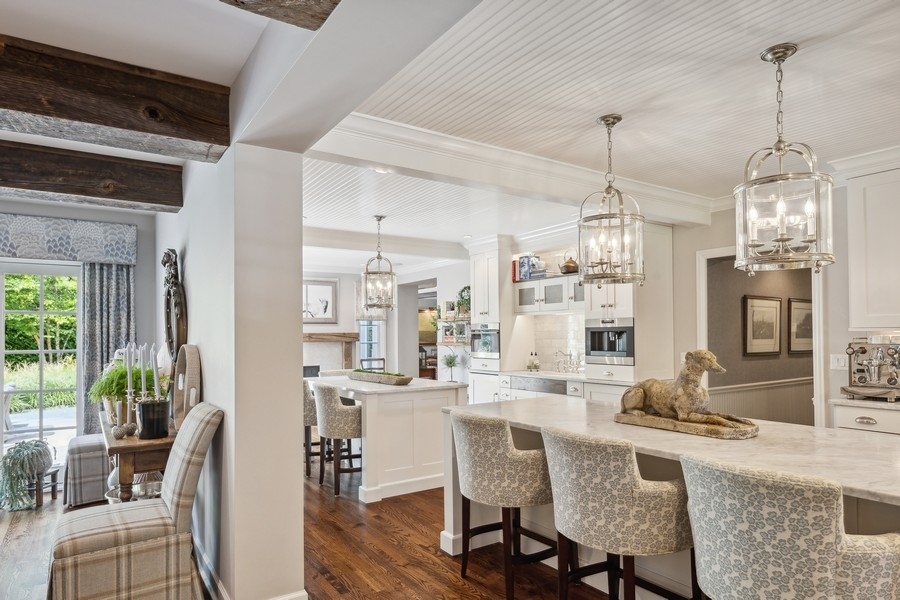 422 Sunset Ridge Road Northfield, IL 60093 - Photo 4 of 52 a dining room with furniture a chandelier and wooden floor