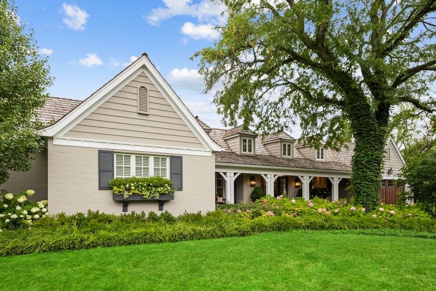 422 Sunset Ridge Road Northfield, IL 60093 - Photo 48 of 52 a front view of a house with a garden