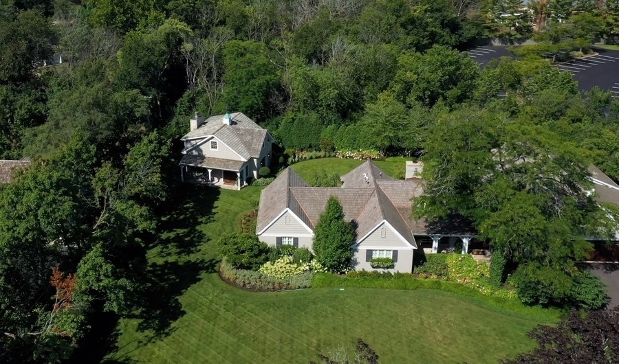 422 Sunset Ridge Road Northfield, IL 60093 - Photo 49 of 52 an aerial view of a house with a big yard and large trees