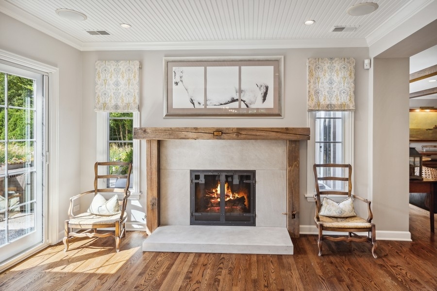 422 Sunset Ridge Road Northfield, IL 60093 - Photo 9 of 52 a living room with furniture and a fireplace