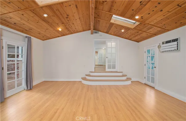 a view of an entryway with wooden floor
