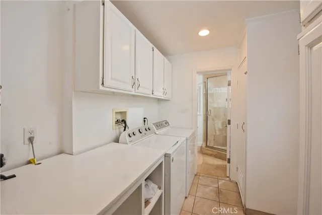 a room with a sink and cabinets