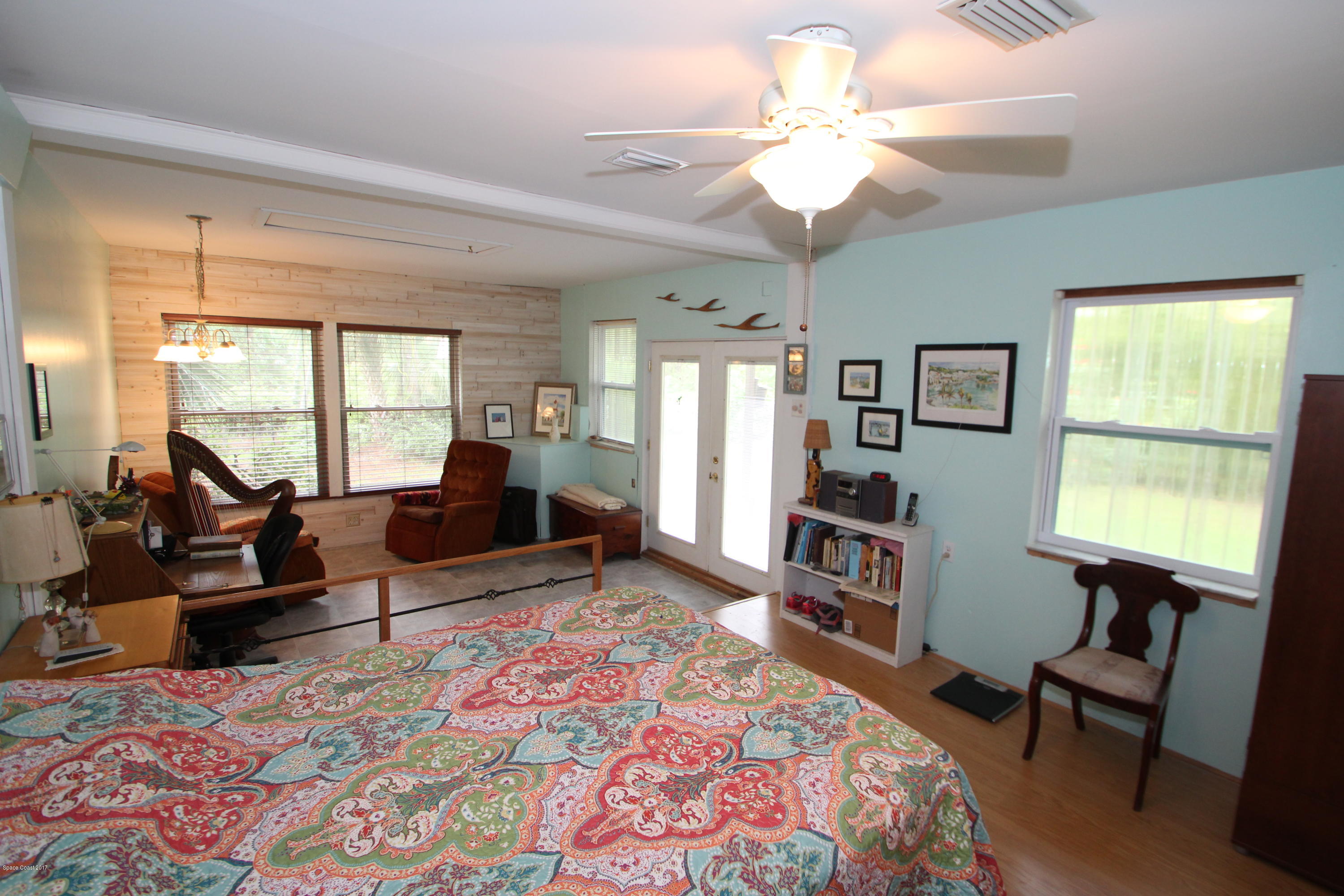 1666 Emmaus Road Northwest Palm Bay, FL 32907 - Photo 8 of 15 a living room with furniture and a window