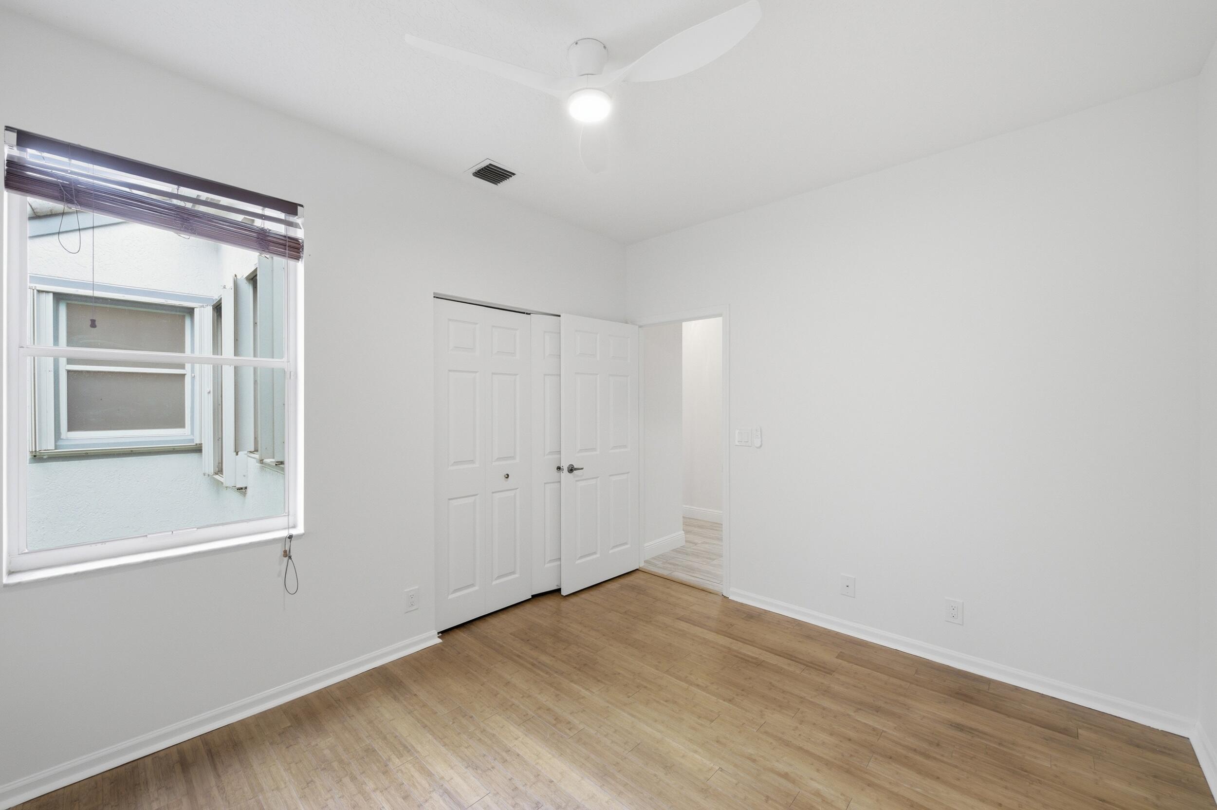 8534 Vía D Oro Boca Raton, FL 33433 - Photo 27 of 34 a view of an empty room with closet and a window