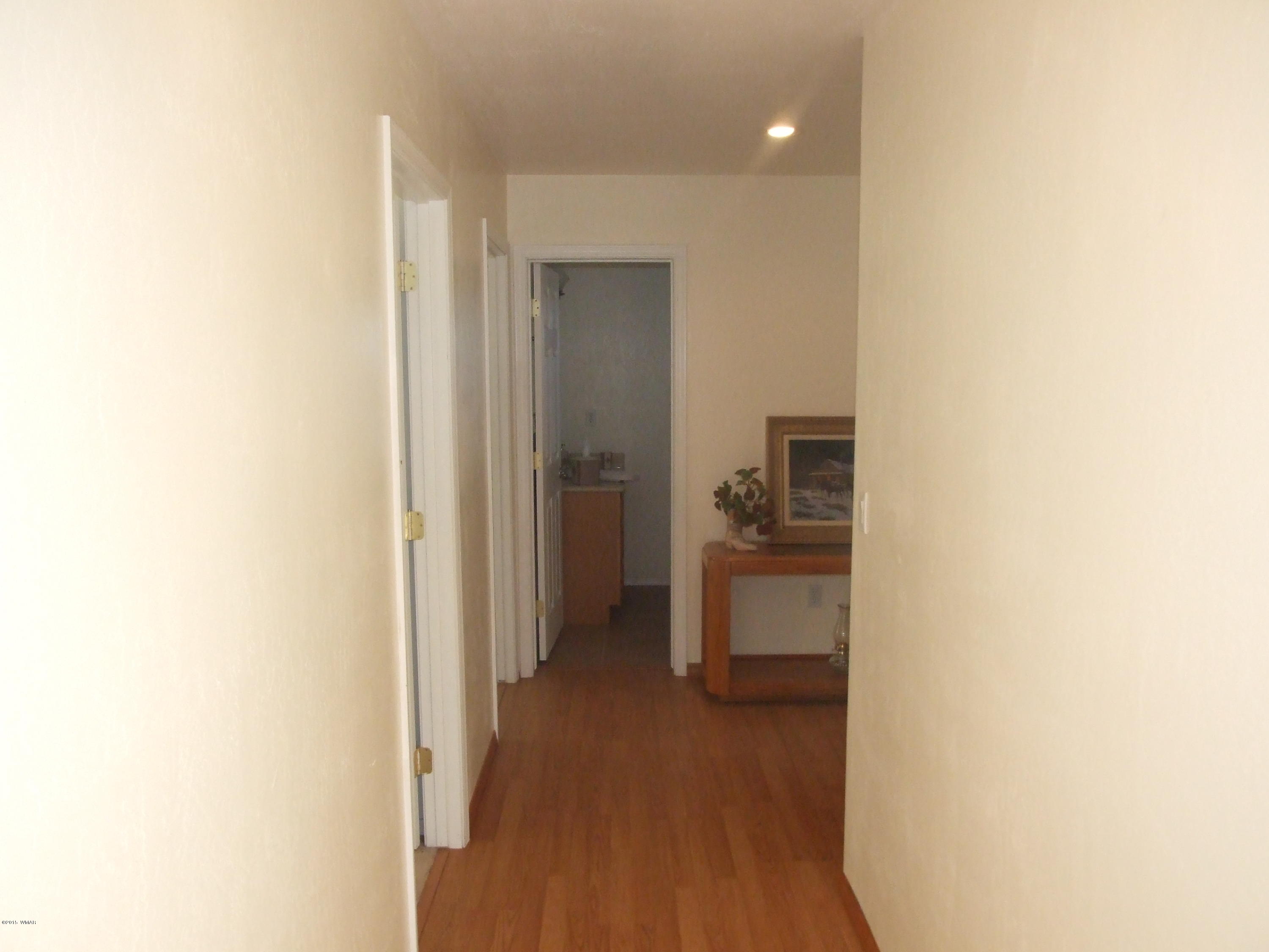 2887 South Bourdon Ranch Road Taylor, AZ 85939 - Photo 15 of 24 a view of a hallway with a livingroom and a bathroom