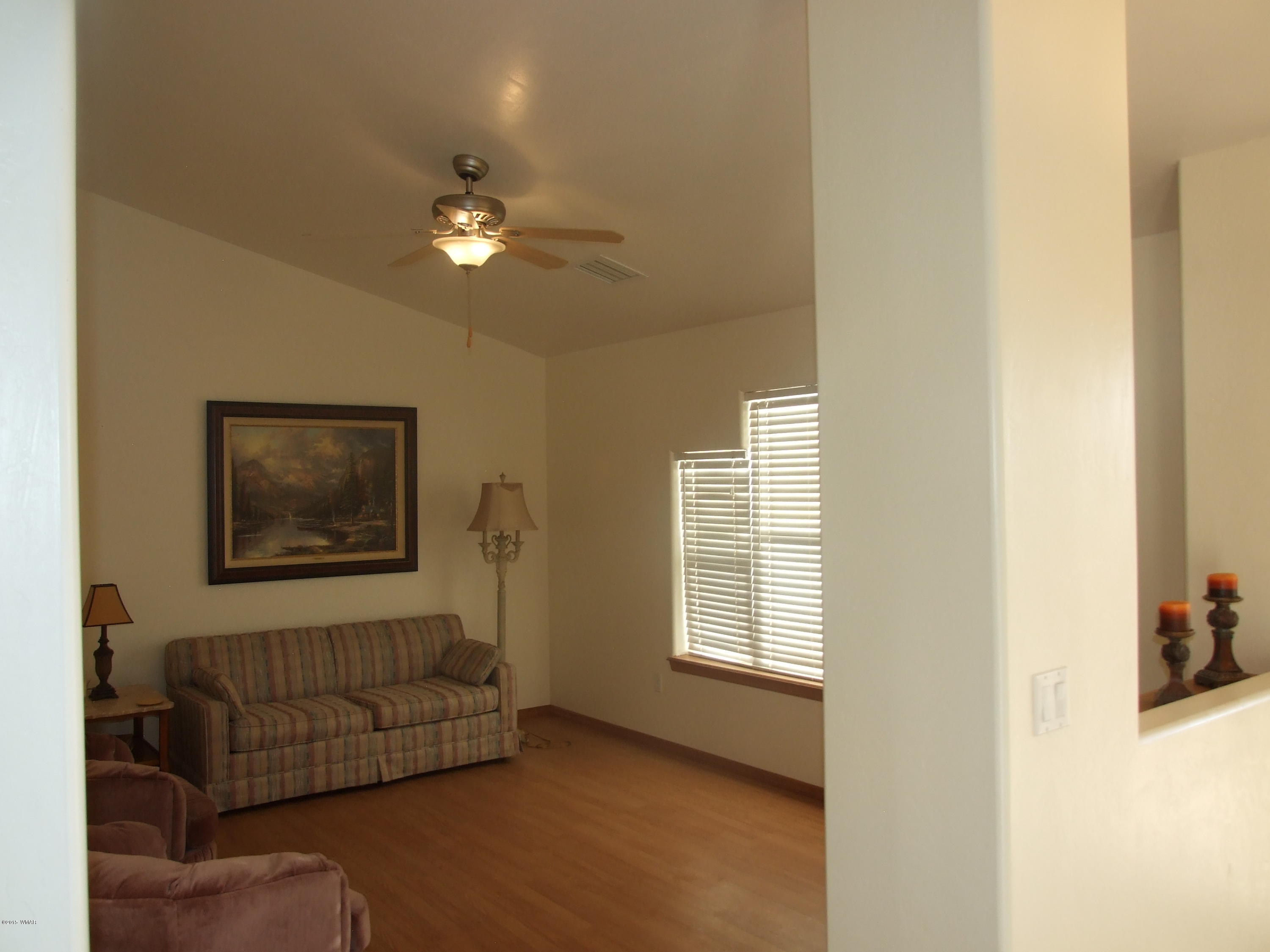 2887 South Bourdon Ranch Road Taylor, AZ 85939 - Photo 4 of 24 a living room with furniture and a window