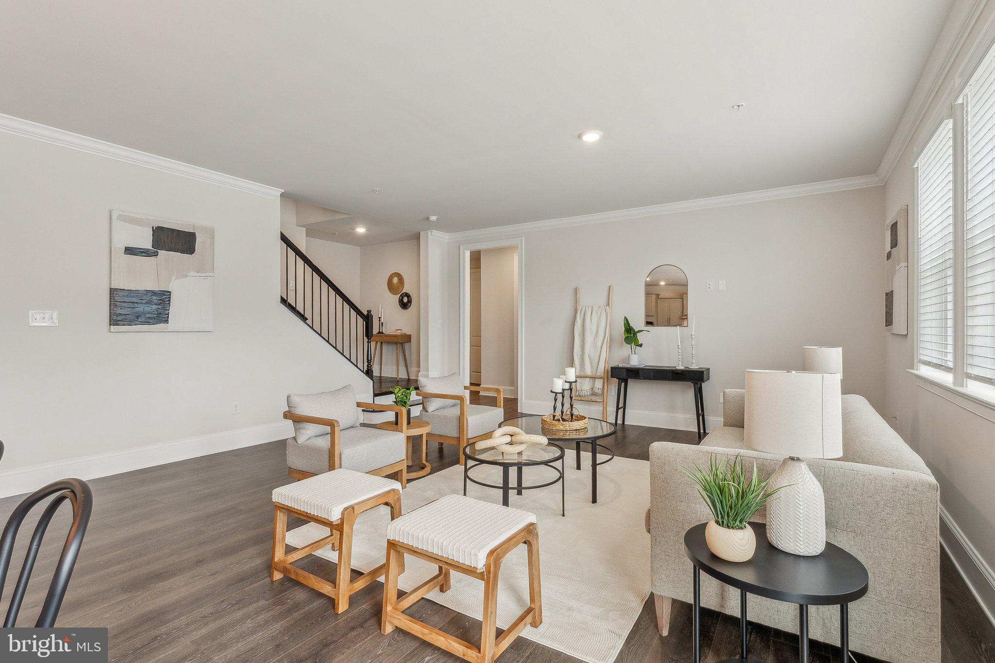 2841 Broad Wing Drive Odenton, MD 21113 - Photo 16 of 71 a living room with couches chairs and couches with wooden floor