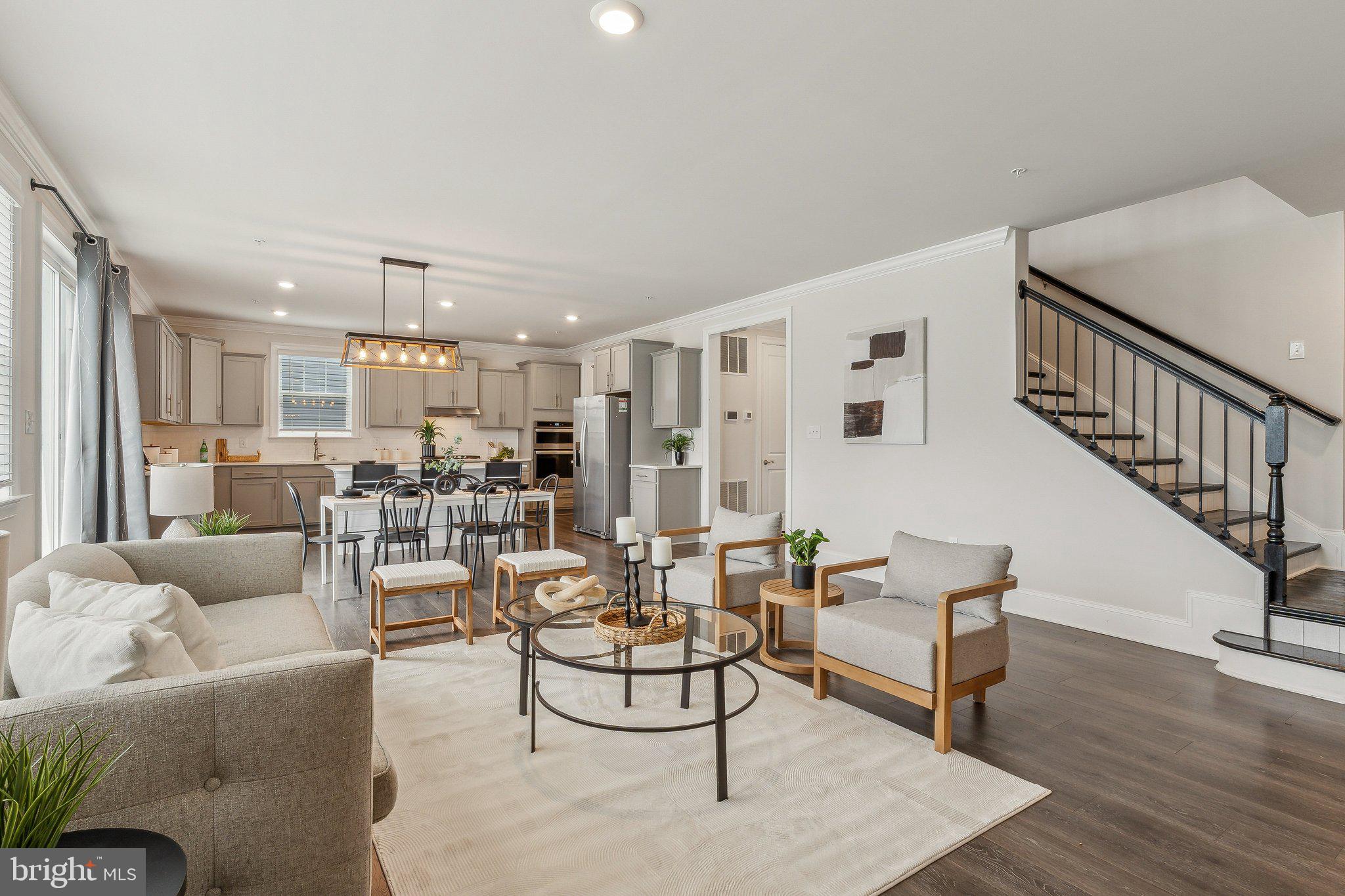 2841 Broad Wing Drive Odenton, MD 21113 - Photo 19 of 71 a living room with furniture and a dining table with wooden floor