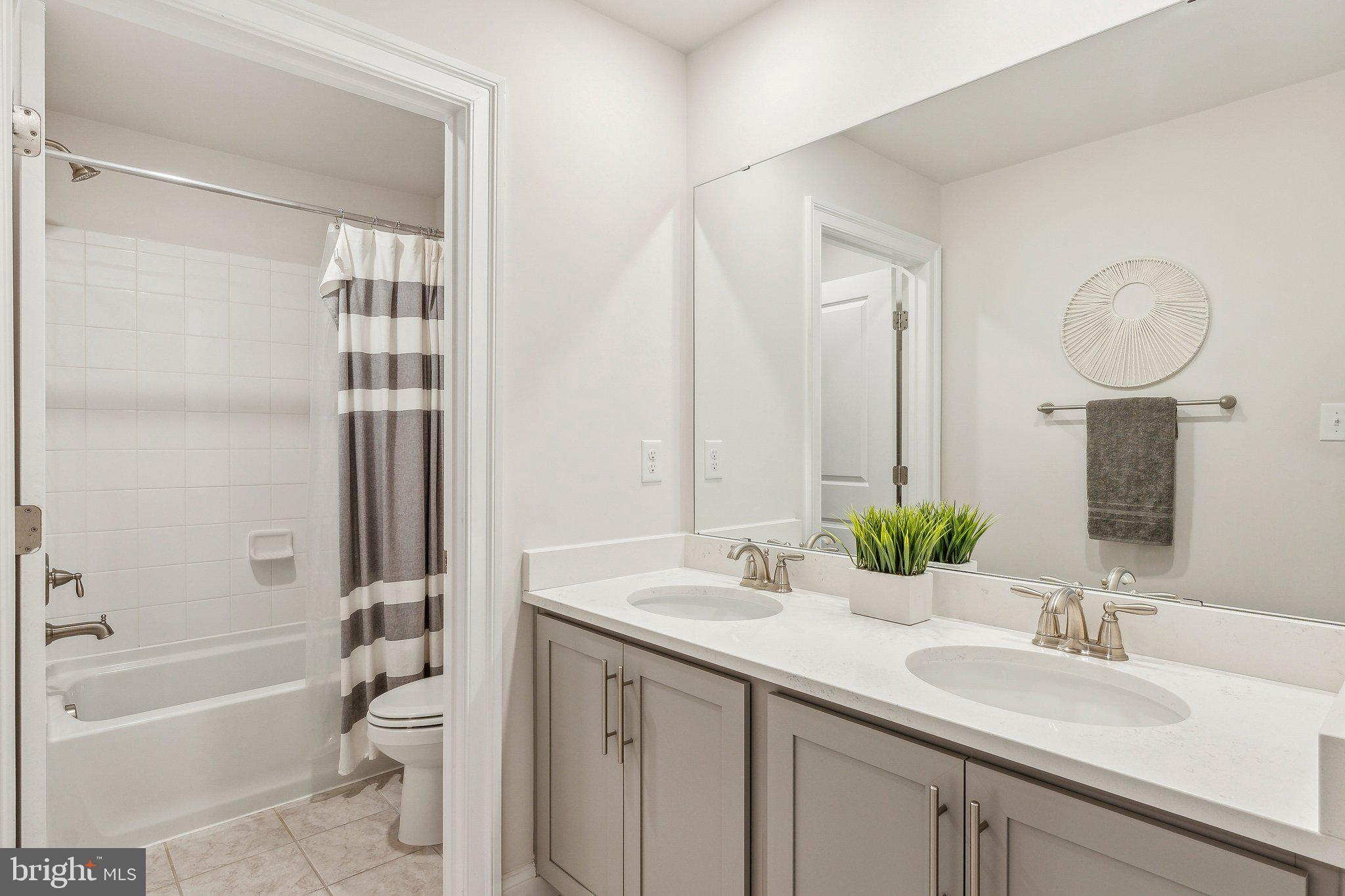 2841 Broad Wing Drive Odenton, MD 21113 - Photo 39 of 71 a bathroom with a sink double vanity granite tub and shower