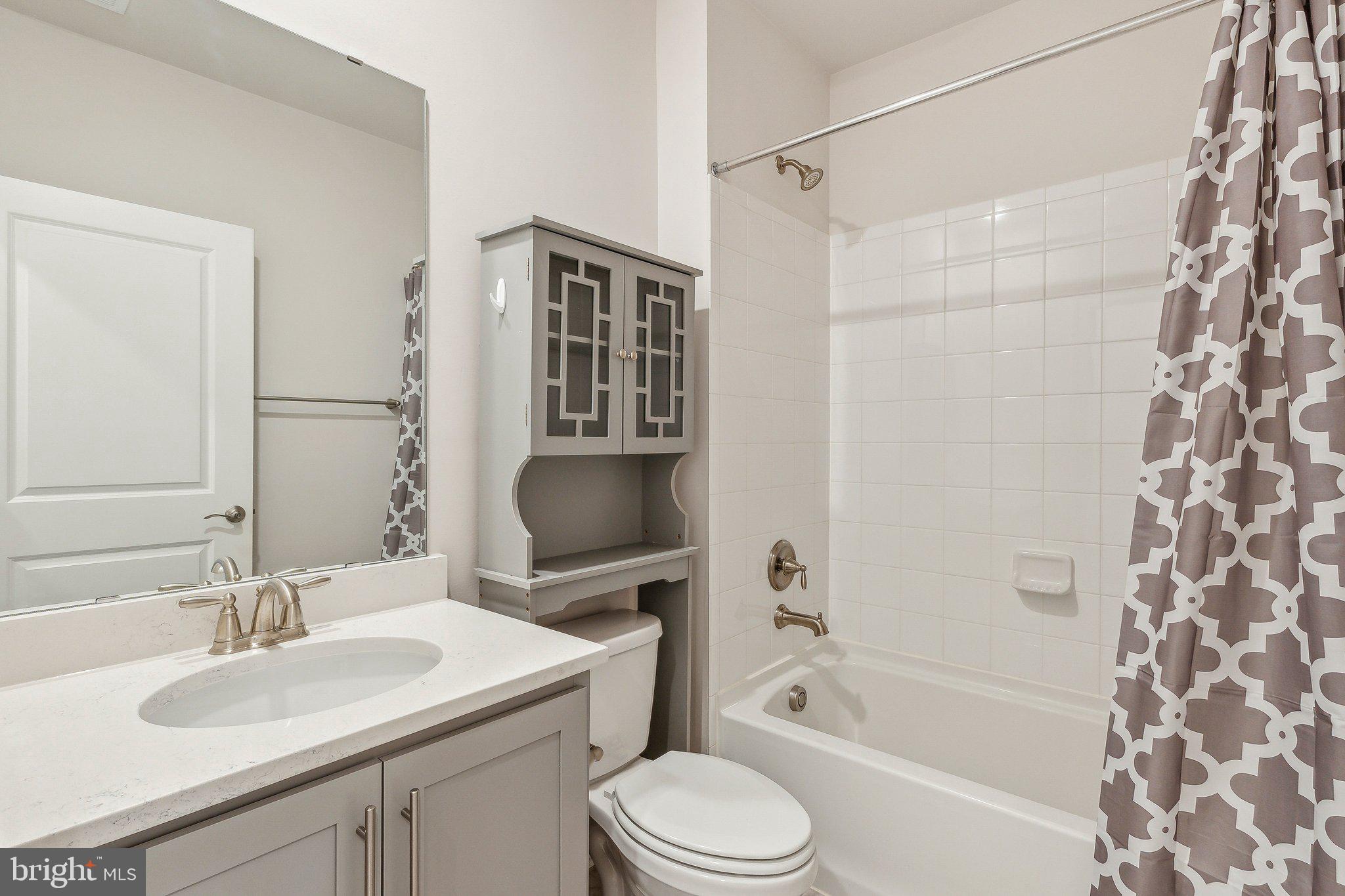 2841 Broad Wing Drive Odenton, MD 21113 - Photo 44 of 71 a bathroom with a sink toilet tub and shower