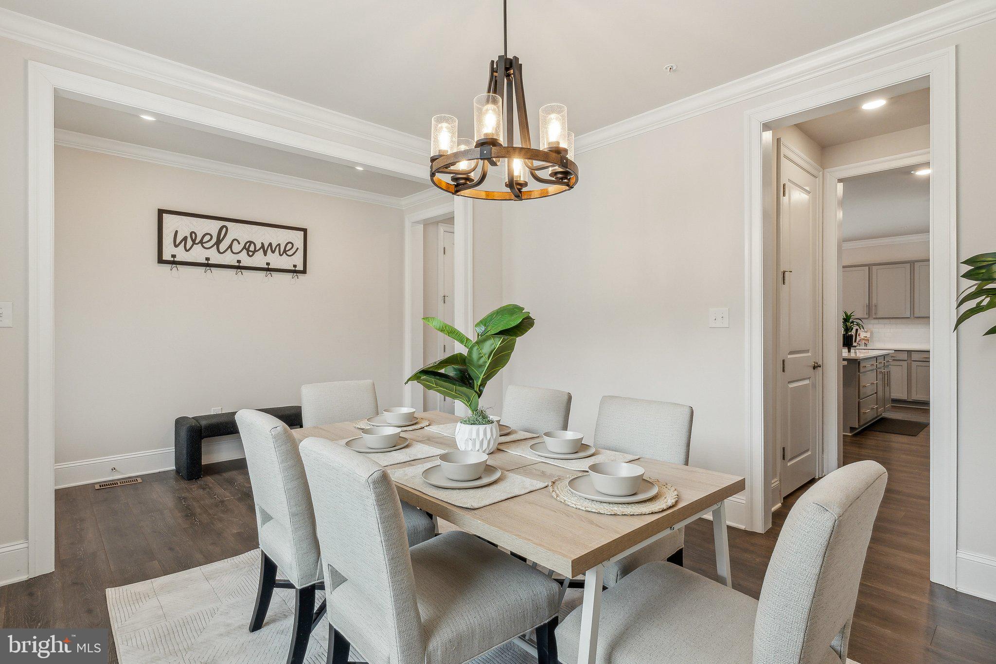 2841 Broad Wing Drive Odenton, MD 21113 - Photo 6 of 71 a view of a dining room with furniture wooden floor and a chandelier
