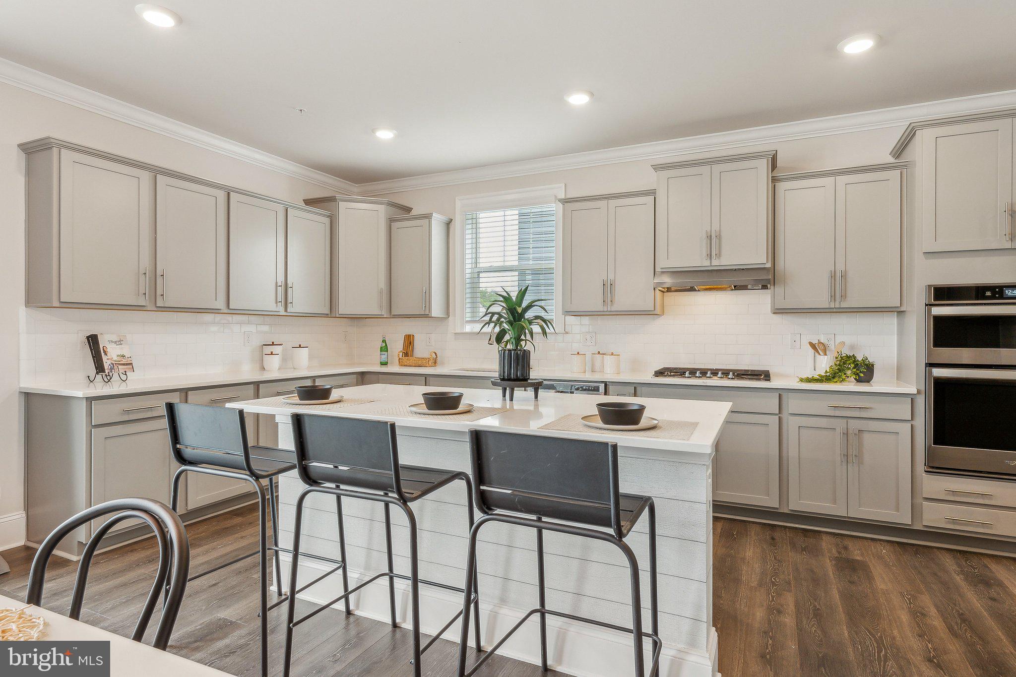 2841 Broad Wing Drive Odenton, MD 21113 - Photo 8 of 71 a kitchen with appliances a sink and cabinets