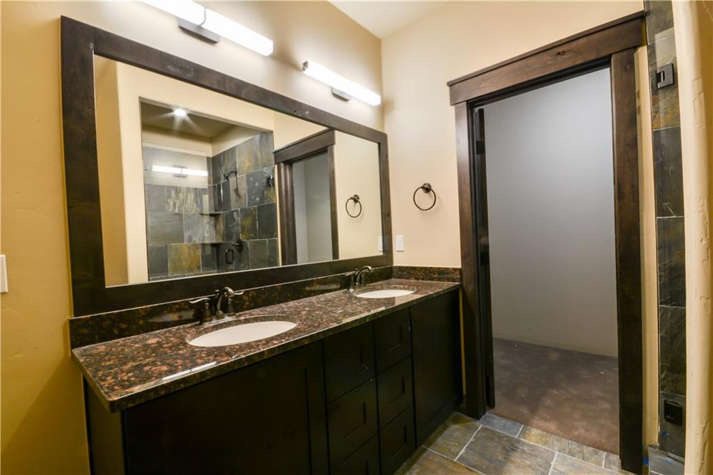 850 Independence Road, Unit 3C Keystone, CO 80435 - Photo 19 of 25 a bathroom with a granite countertop sink vanity and mirror