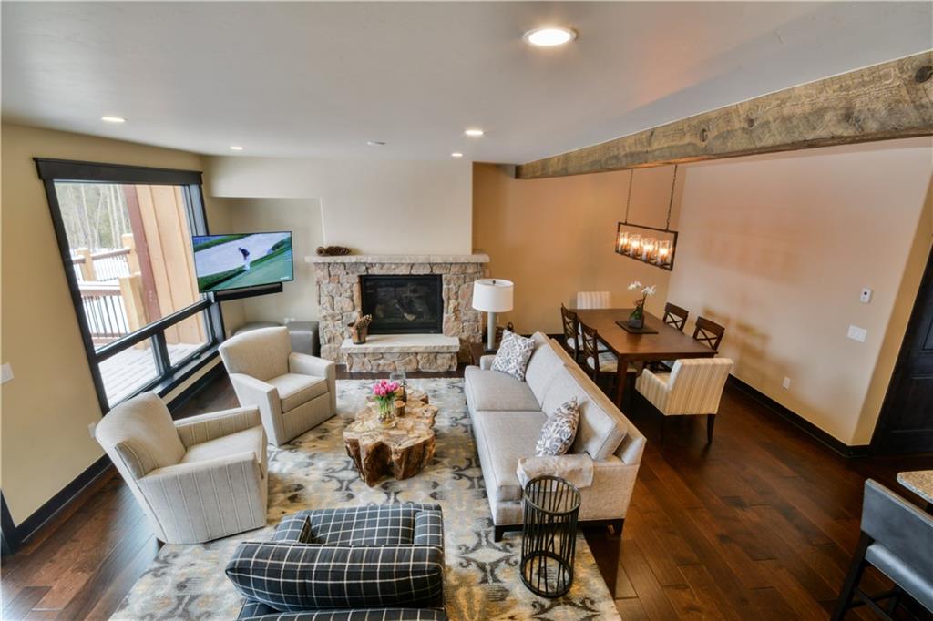 850 Independence Road, Unit 3C Keystone, CO 80435 - Photo 22 of 25 a living room with furniture and a flat screen tv