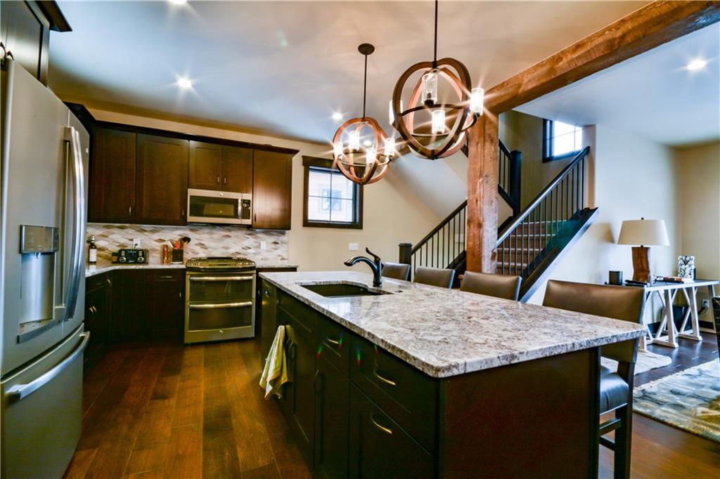 850 Independence Road, Unit 3C Keystone, CO 80435 - Photo 25 of 25 a kitchen with a table a sink and refrigerator