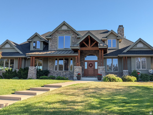 3700 Foothill Lane Eden, UT 84310 - Photo 1 of 1 Craftsman inspired home with roof with shingles, a front lawn, stone siding, and a chimney