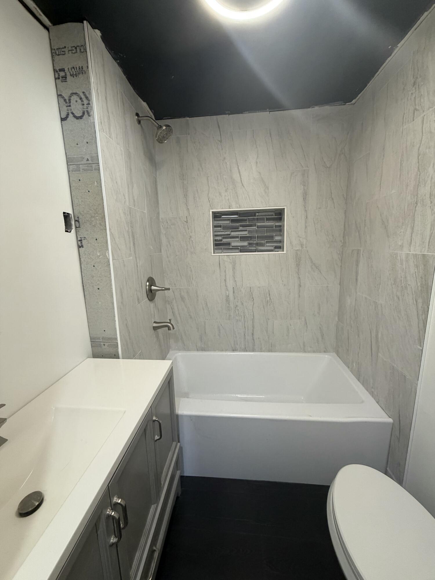 426 Cherry Street Hammond, IN 46324 - Photo 4 of 6 a bathroom with a sink a toilet and bathtub