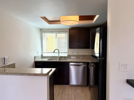 a kitchen with a sink and cabinets