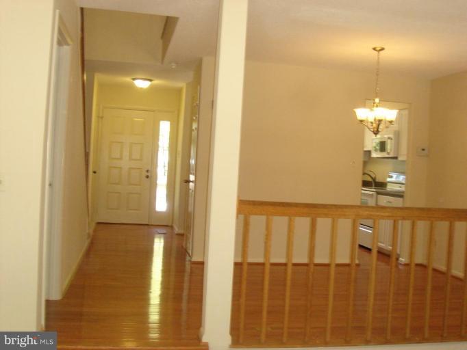 1646 Oak Spring Way Reston, VA 20190 - Photo 13 of 29 gleaming oak hardwood flooring in hallway