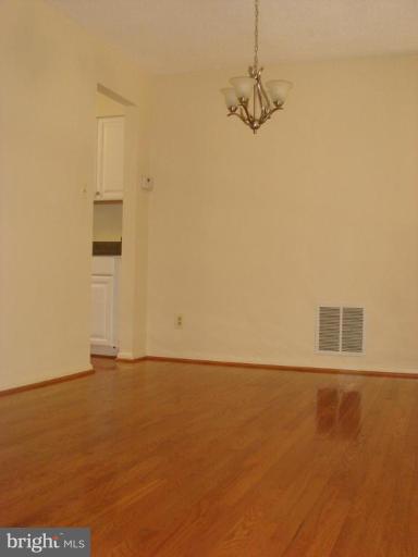 1646 Oak Spring Way Reston, VA 20190 - Photo 5 of 29 Gleaming oak hardwood flooring in Dining Room