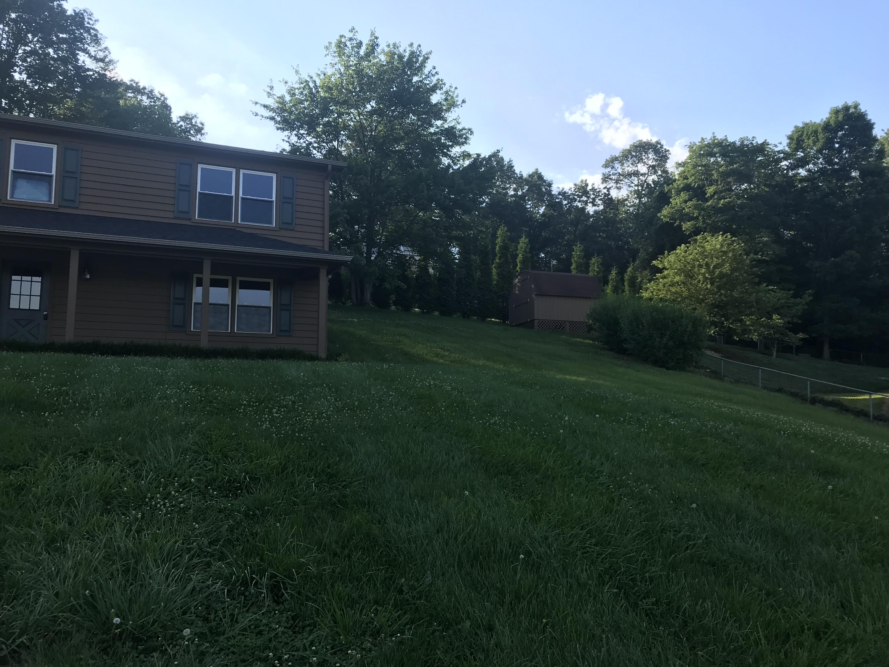 53 Almond Circle Blue Ridge, VA 24064 - Photo 2 of 21 a brick house with a small yard
