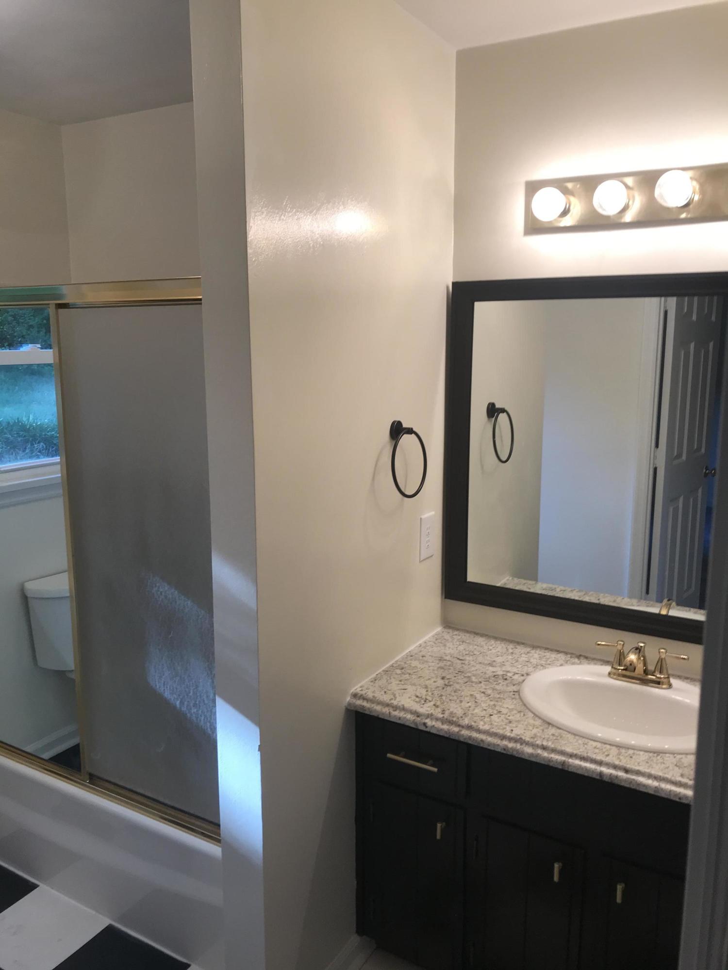 53 Almond Circle Blue Ridge, VA 24064 - Photo 17 of 21 a bathroom with a granite countertop sink and a mirror