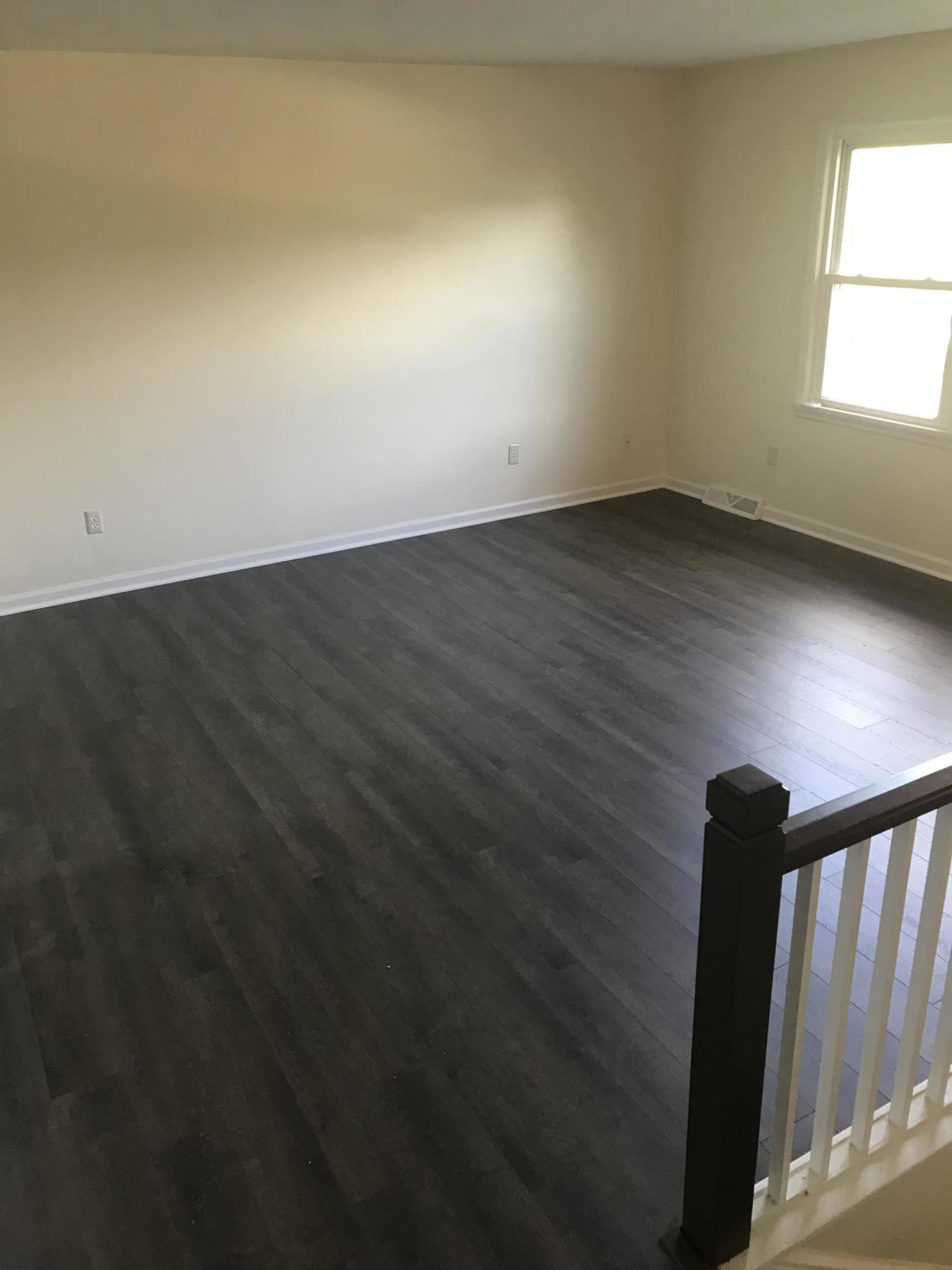 53 Almond Circle Blue Ridge, VA 24064 - Photo 10 of 21 an empty room with wooden floor and windows