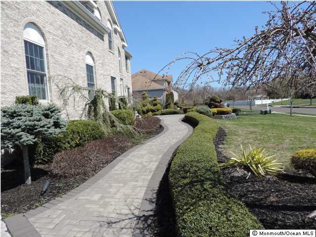8 Cedar Knoll Road Jackson, NJ 08527 - Photo 2 of 25 a backyard of a house with a yard and outdoor seating