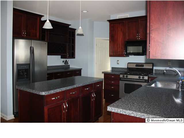 8 Cedar Knoll Road Jackson, NJ 08527 - Photo 8 of 25 a kitchen with a refrigerator stove and sink