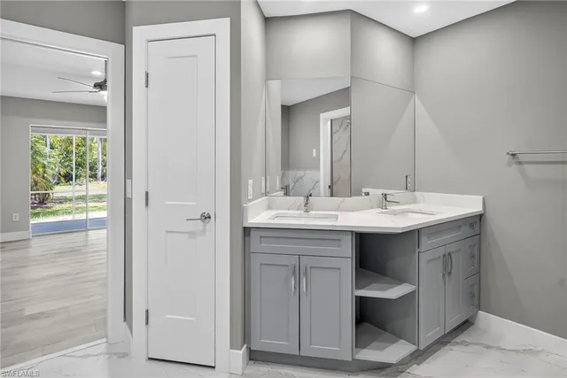 a bathroom with a sink and a mirror