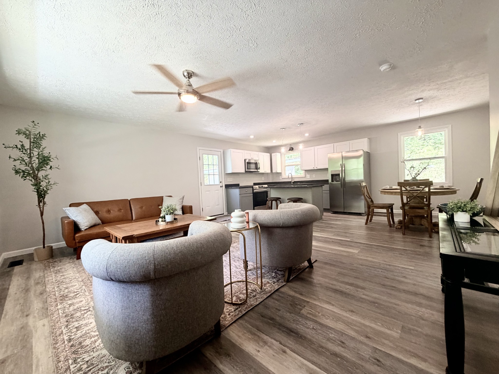 5075 Logan Road Cunningham, TN 37052 - Photo 5 of 22 a living room with furniture and a wooden floor