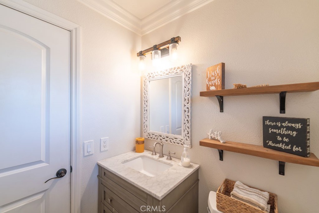 8636 Rancho Cerona Drive Paramount, CA 90723 - Photo 20 of 48 a bathroom with a sink and a mirror