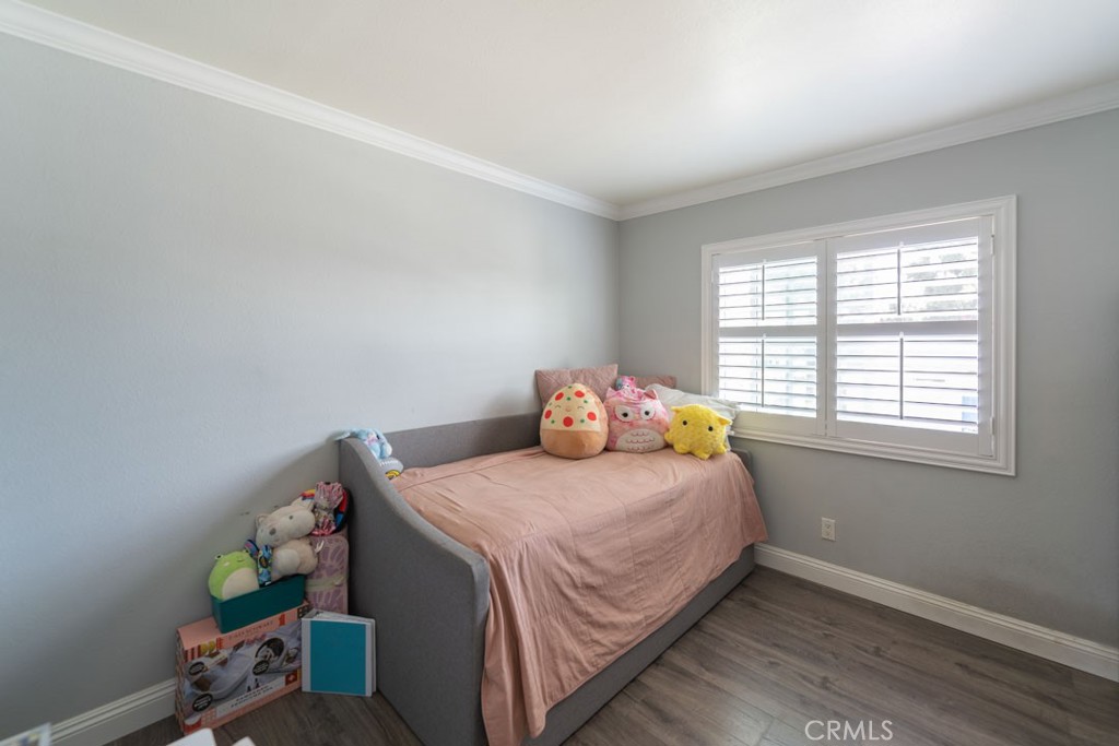 8636 Rancho Cerona Drive Paramount, CA 90723 - Photo 23 of 48 a bedroom with a bed and window