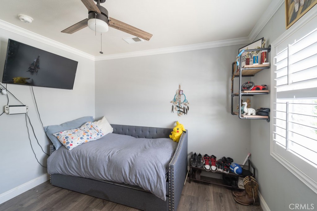 8636 Rancho Cerona Drive Paramount, CA 90723 - Photo 27 of 48 a bedroom with a bed and flat screen tv