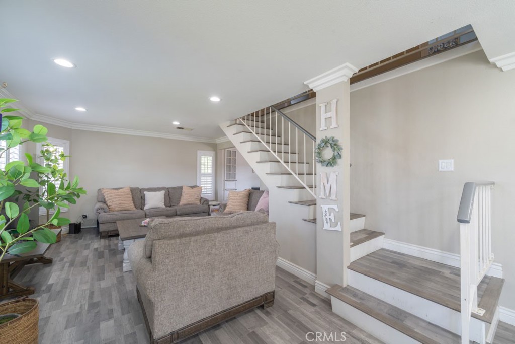 8636 Rancho Cerona Drive Paramount, CA 90723 - Photo 3 of 48 a living room with furniture and stairs