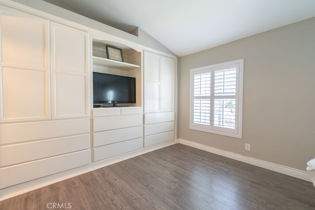 8636 Rancho Cerona Drive Paramount, CA 90723 - Photo 32 of 48 a view of a livingroom with an empty space and wooden floor