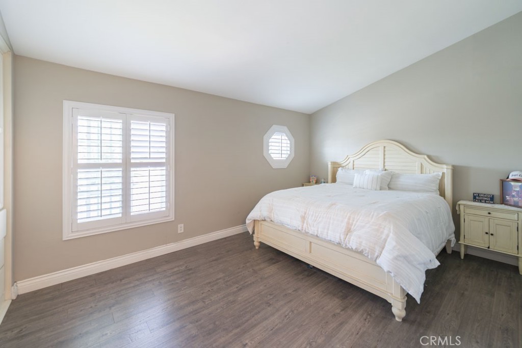 8636 Rancho Cerona Drive Paramount, CA 90723 - Photo 33 of 48 a bedroom with a bed and a window