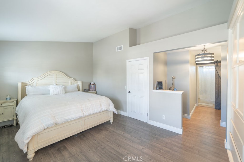 8636 Rancho Cerona Drive Paramount, CA 90723 - Photo 34 of 48 a bedroom with a bed and a mirror