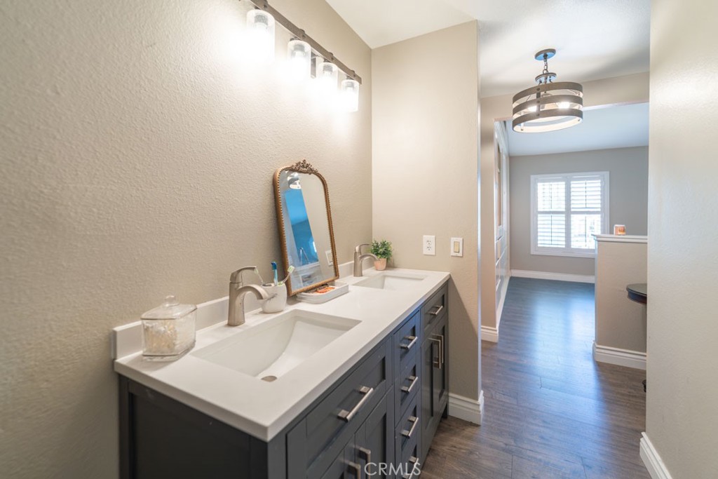 8636 Rancho Cerona Drive Paramount, CA 90723 - Photo 39 of 48 a bathroom with a sink and a mirror