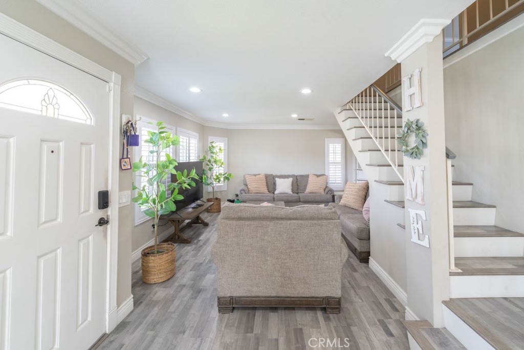 8636 Rancho Cerona Drive Paramount, CA 90723 - Photo 4 of 48 a living room with furniture and wooden floor